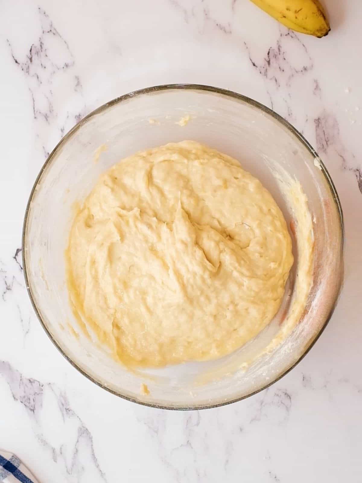 Sour Cream Banana Cake Batter in large mixing bowl after wet and dry ingredients have been folded together.