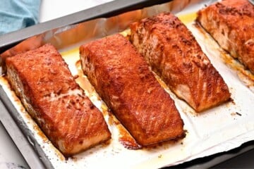 Seasoned Baked Salmon on a sheet pan lined with foil.