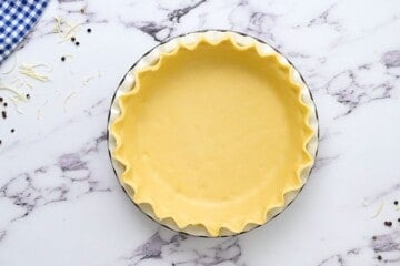 Pie crust shaped in pie pan before baking.