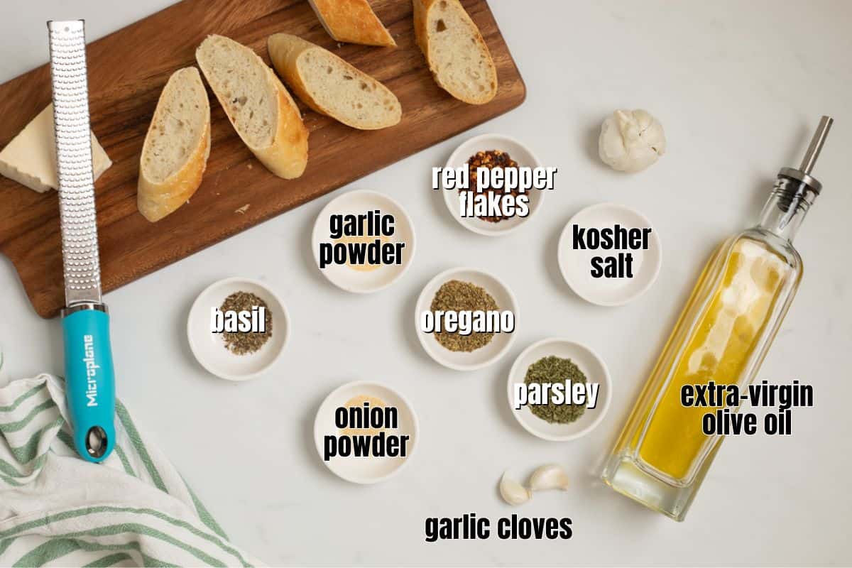 Ingredients for olive oil bread dip labeled on counter.