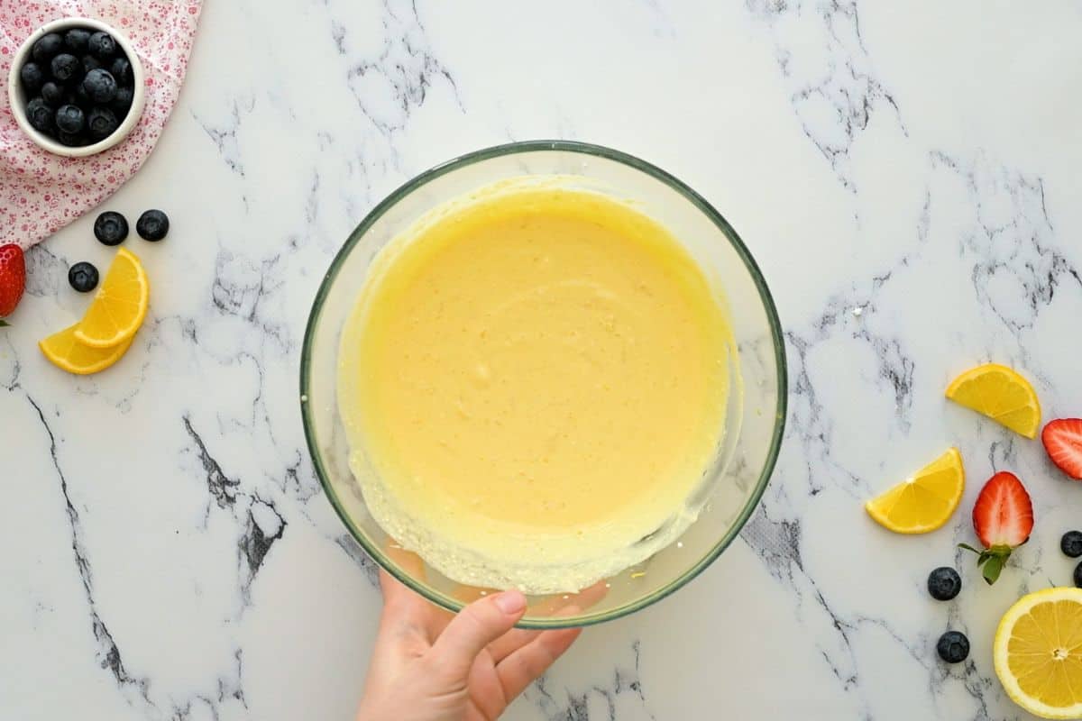 Wet ingredients for lemon ricotta pancakes in large mixing bowl.