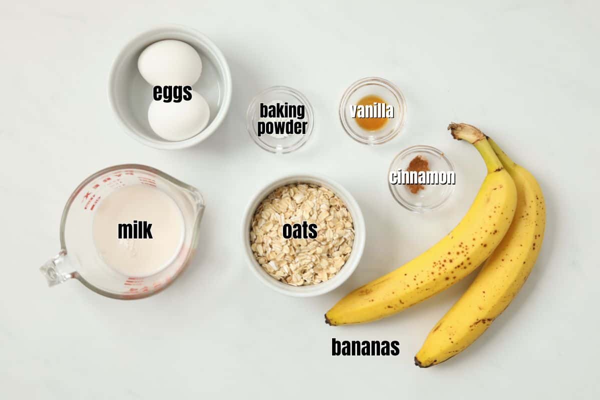 Ingredients for banana oatmeal pancakes labeled on counte.r