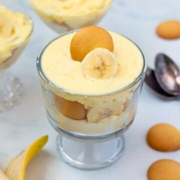 Banana Pudding layered in mini trifle cups with vanilla wafers and banana slices.