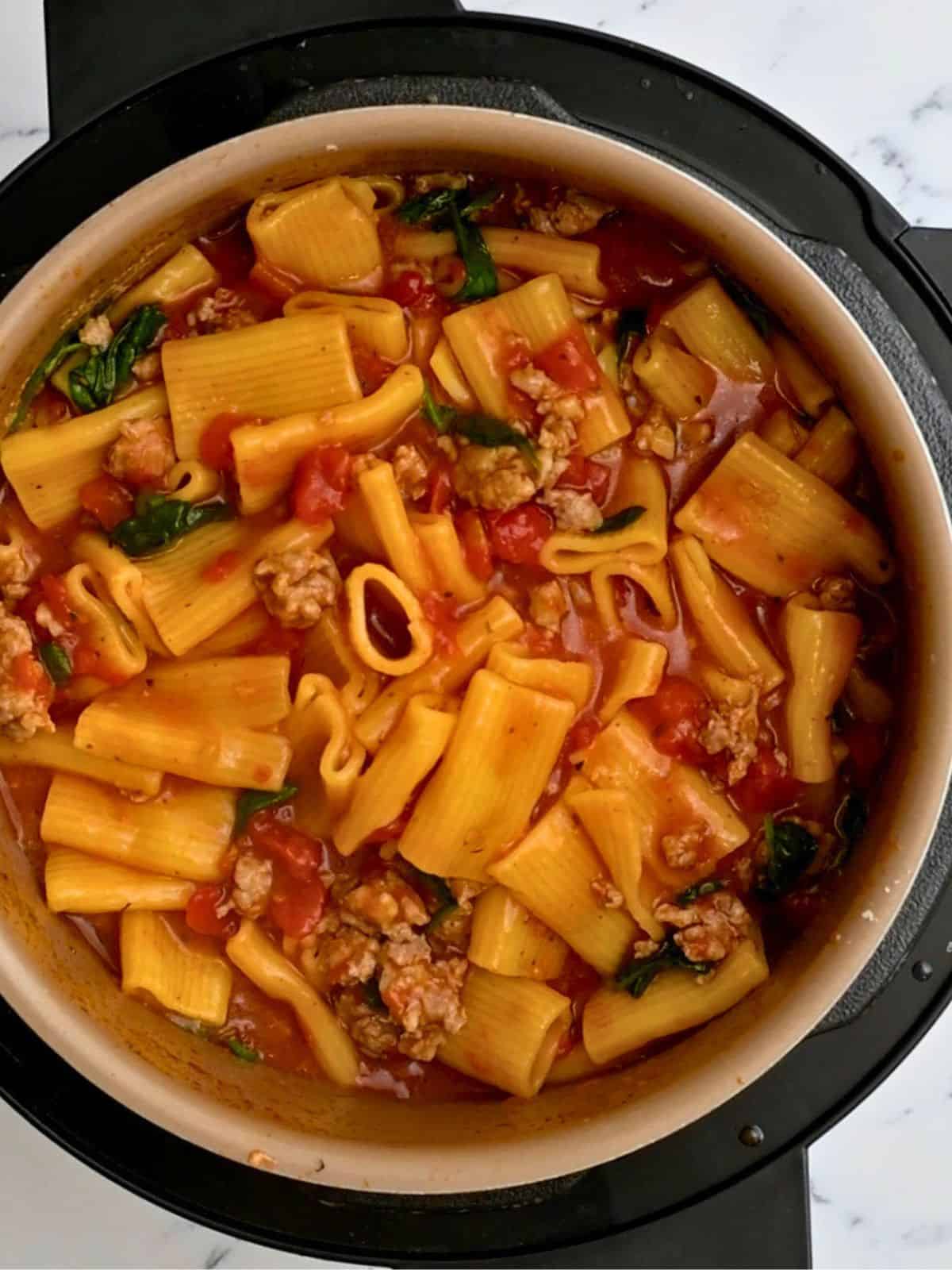 Instant Pot Filled with perfectly cooked rigatoni and sausage in a diced tomato sauce.
