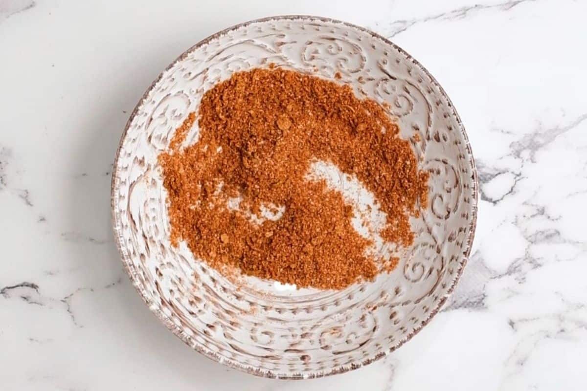 Ingredients for salmon rub in small mixing bowl.