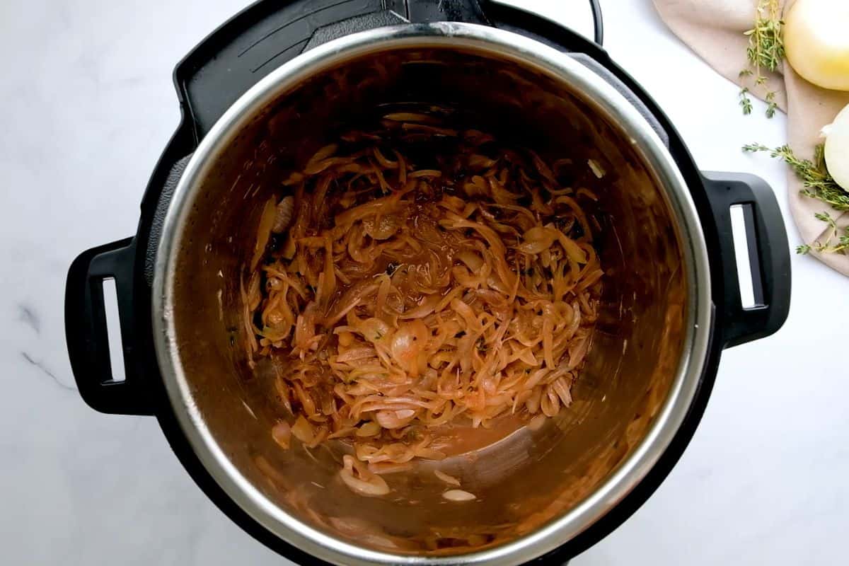Caramelized Onions inside inner pot after adding red wine and deglazing inner pot.