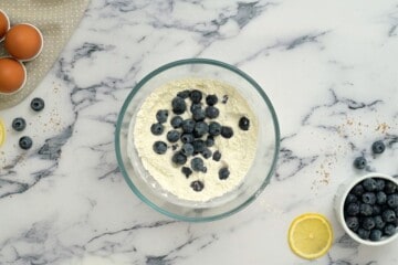 Blueberries in flour mixture for blueberry coffee cake.