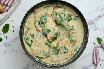 Pan seared chicken cutlets in creamy spinach sauce.