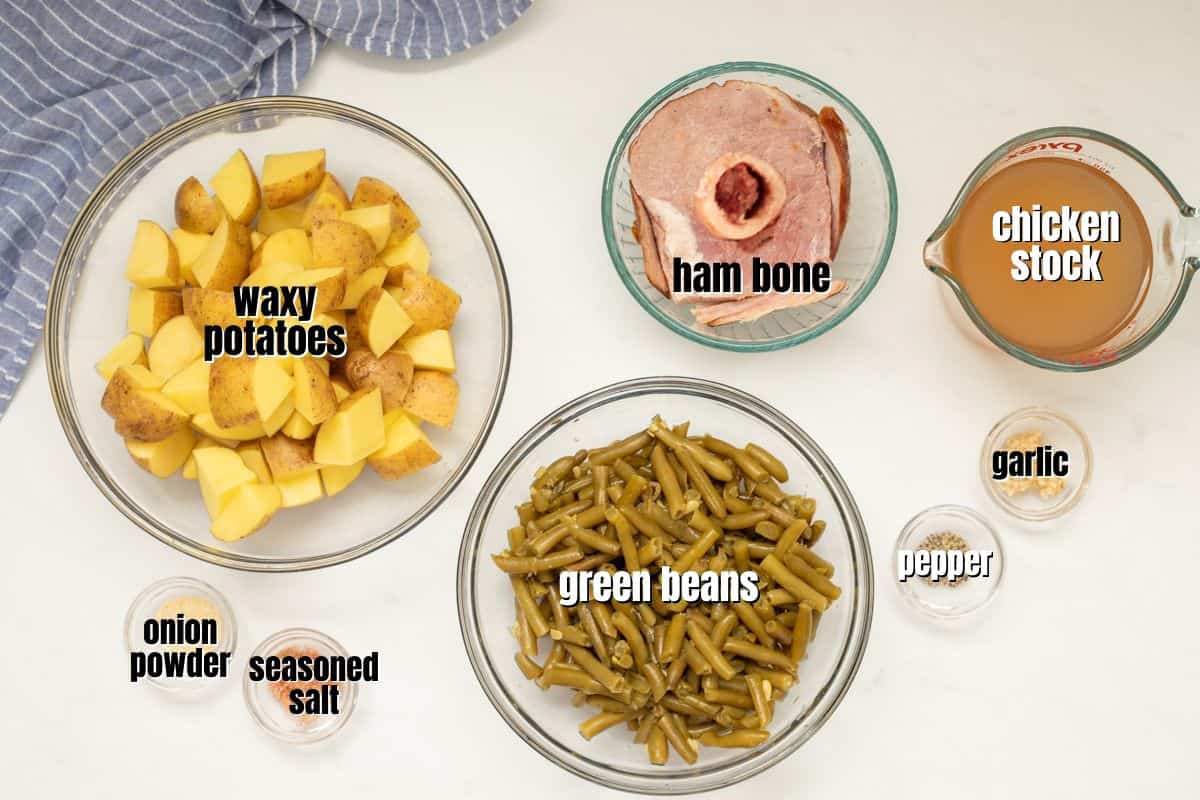Ingredients for potatoes, green beans, and ham labeled on counter.