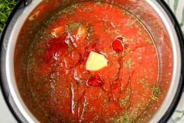 Ingredients for Instant Pot Spaghetti Sauce layered inside inner pot of Instant Pot.