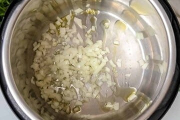 Onions sauteed in inner pot for spaghetti sauce.