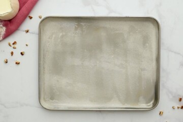 Floured and greased sheet pan for Texas sheet cake recipe.