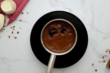 Saucepan with water, butter, and cocoa mixture bubbling on hot plate.