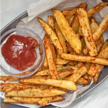 Basket of homemade fries served with ketchup that were made in Air Fryer French Fries.