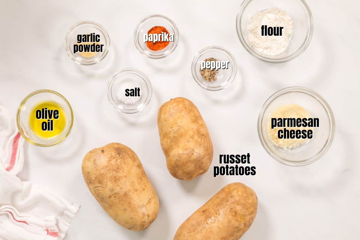Ingredients for potato wedges on counter with text overlay.