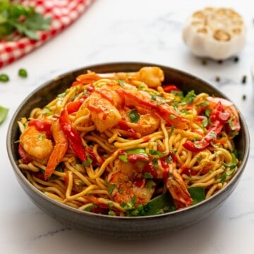 Shrimp Lo Mein made with lo mein noodles and vegetables in bowl topped with fresh cilantro.