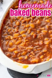 Homemade baked beans in large white casserole dish with title text overlay that reads homemade baked beans.