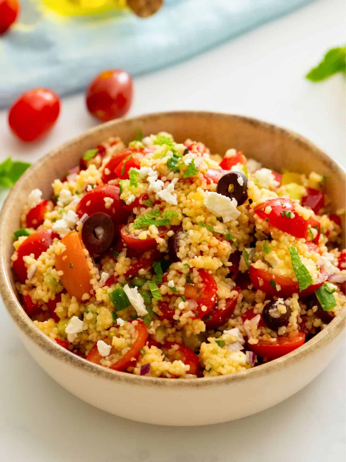 Cold Couscous Salad made with olives, tomatoes, and feta.