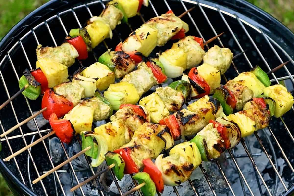 Pineapple Chicken Kabobs on charcoal grill.