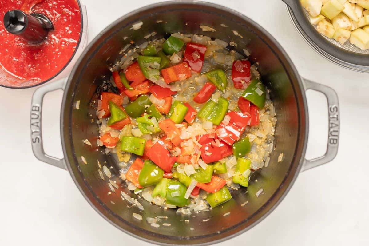 Sauteed vegetables in large stock pan after being softened and dry white wine added to pan. 