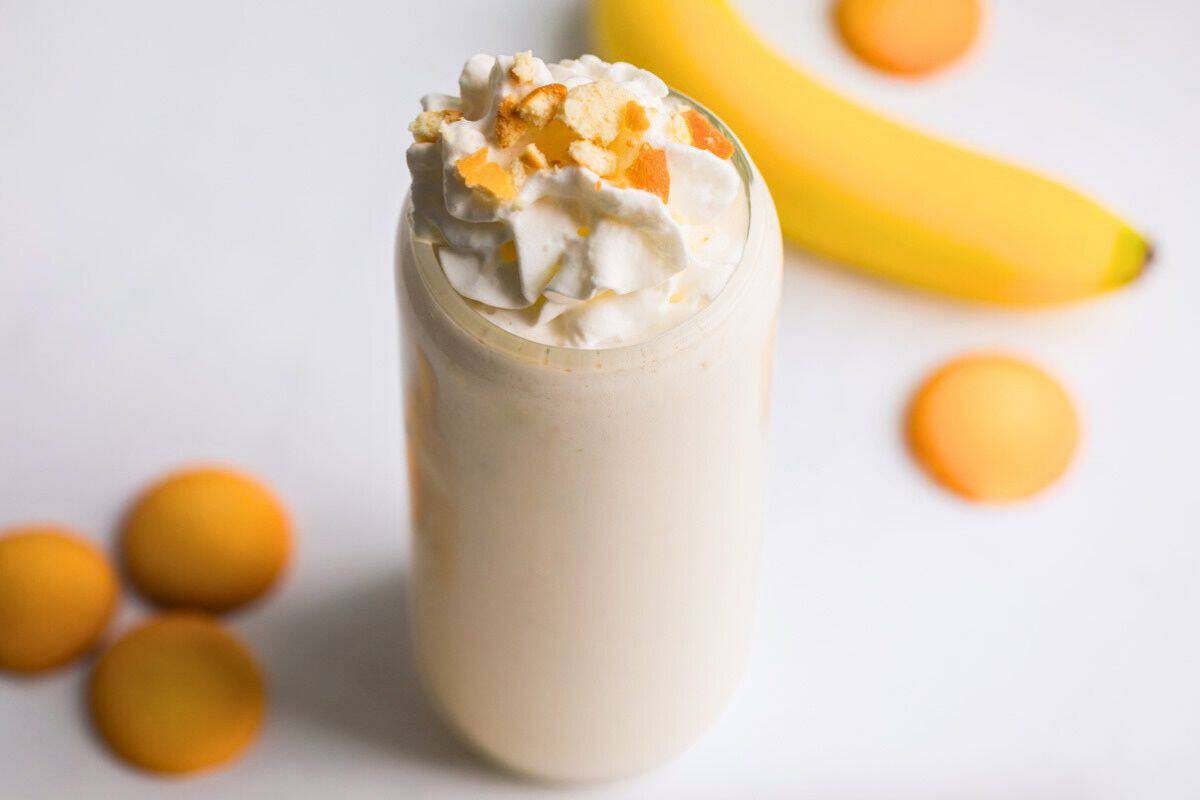 Banana Smoothie made with cottage cheese and vanilla wafers in background.