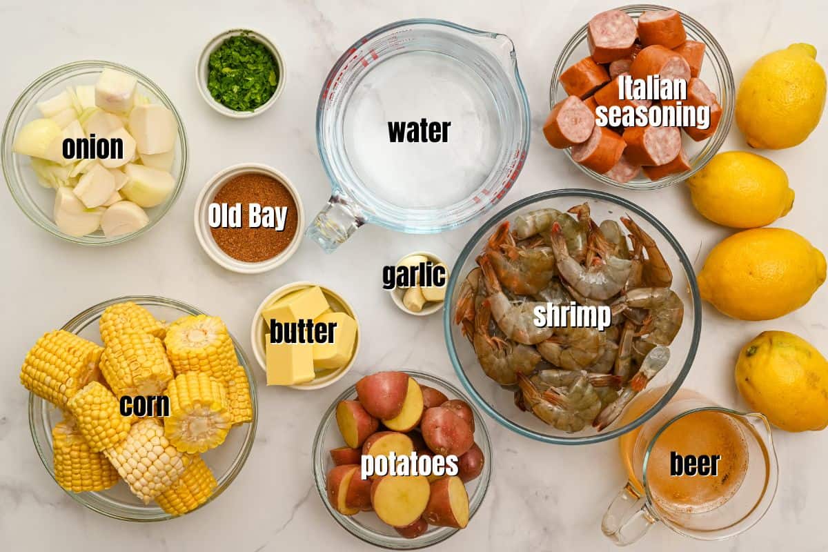 Ingredients for shrimp boil labeled on counter.