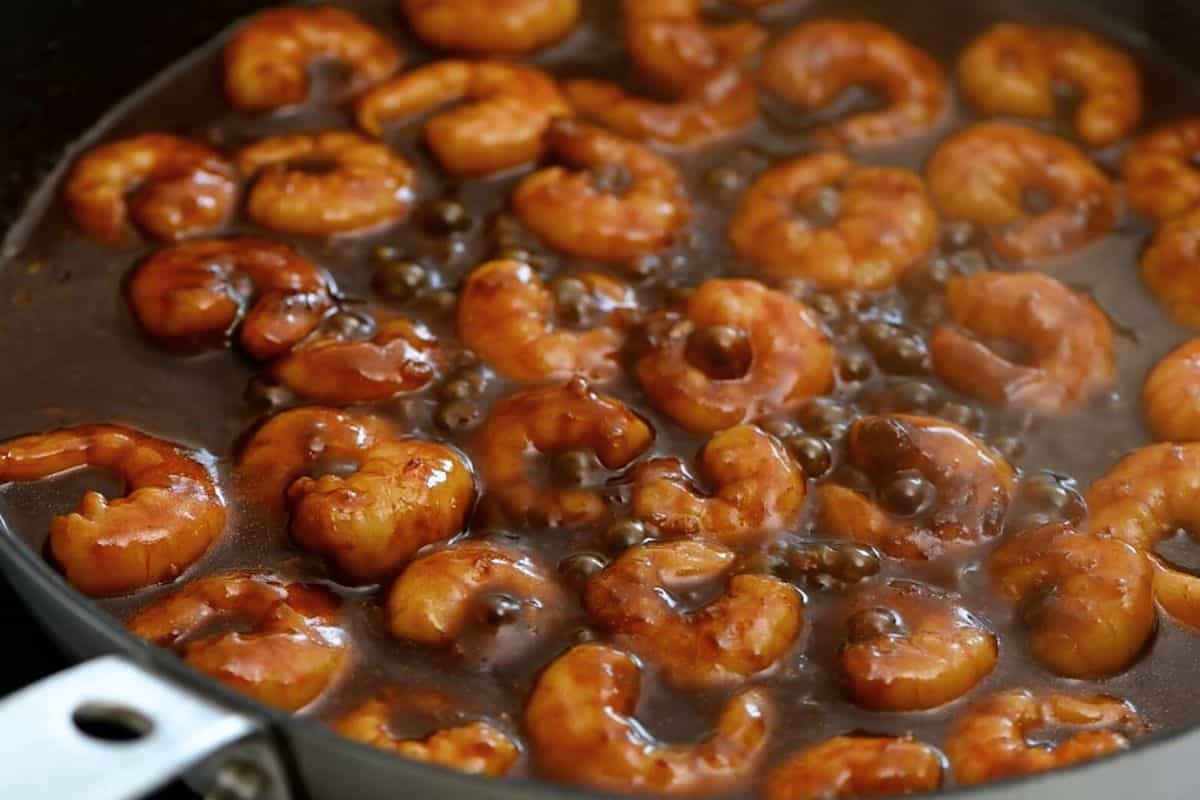 Sauteed Shrimp in skillet with homemade general sauce.