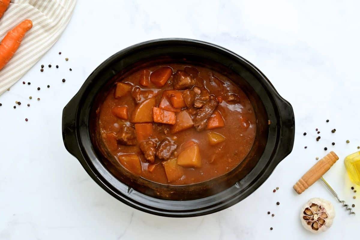 Beef Stew Beef Stew with potatoes and carrots in slow cooker after slow cooking but before being thickened.