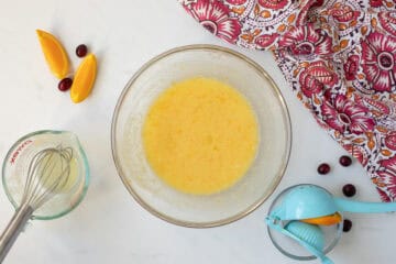 Butter, sugar, orange zest, eggs, vanilla, orange juice, and milk combined in large mixing bowl.