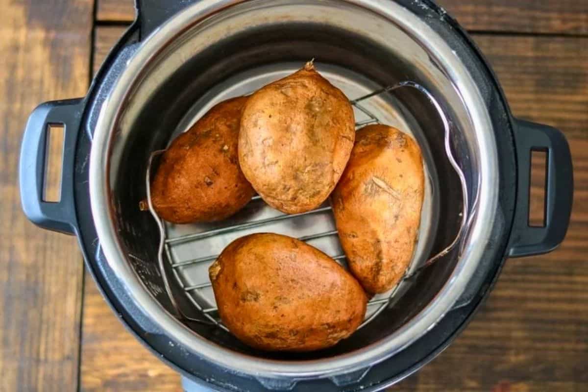 make ahead Instant Pot Thanksgiving Recipes 6 sweet potatoes inside inner pot after being pressure cooked.