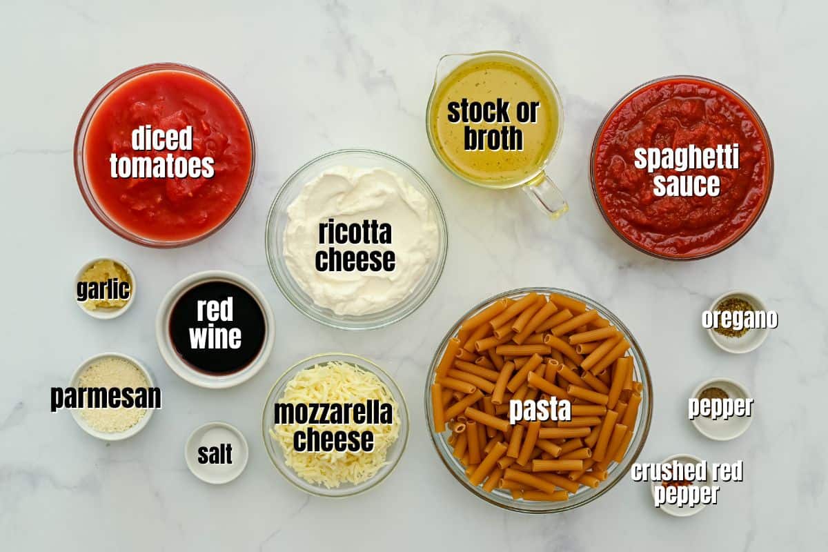 Ingredients for Instant Pot Pasta with ricotta and cheese labeled on counter.