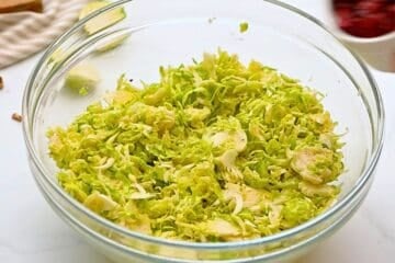 Shaved brussels sprouts tossed with honey lemon dressing.