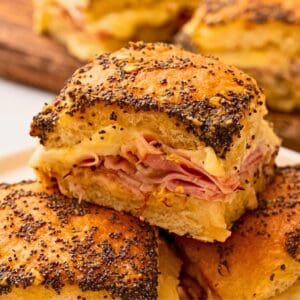Close up of sliders sliders made with ham, cheese, Hawaiian rolls and butter poppy seed glaze.