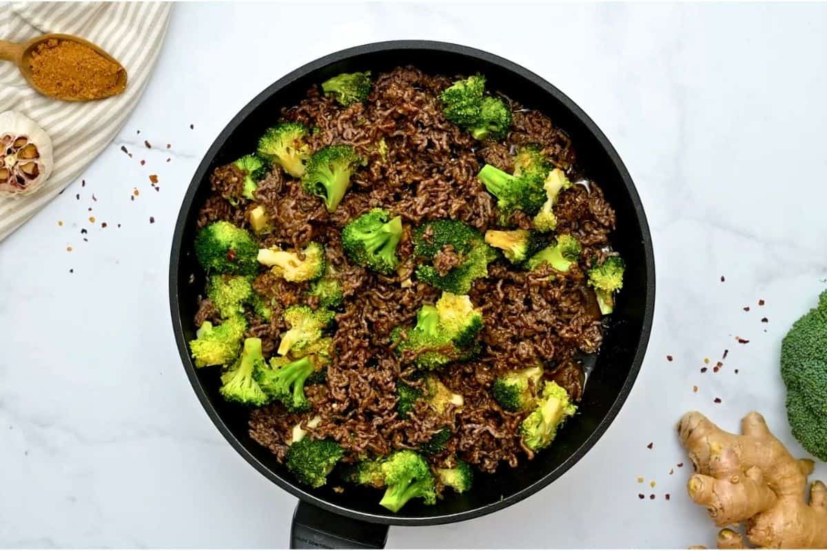 20 Minute Beef and Broccoli Recipe Sautéed ground beef with crisp tender broccoli tossed with sweet and savory sauce in sauté pan.
