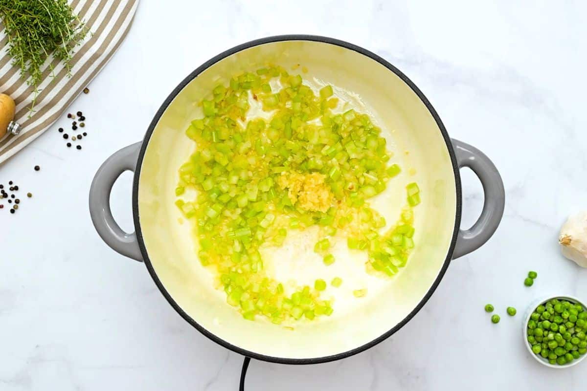 Chicken Pot Pie Soup Recipe Onions, celery, and garlic sauteed in large soup pot to form base of chicken pot pie soup.