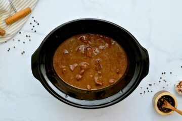 Slow cooked beef tips with gravy after thickening with cornstarch mixture.