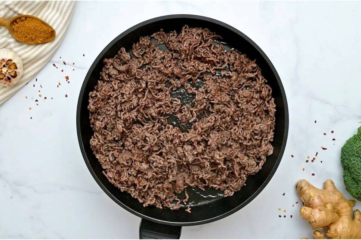 Ground Beef Stir Fry Browned ground beef in skillet after being cooked through.