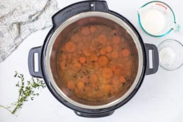 Wild rice soup in Instant Pot after being pressure cooked and pressure released before adding cream.
