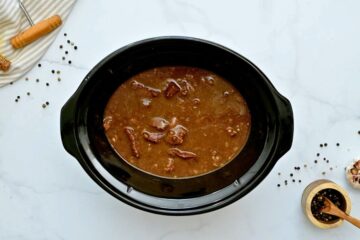Beef tips in slow cooker after being slow cooked for 8 hours.