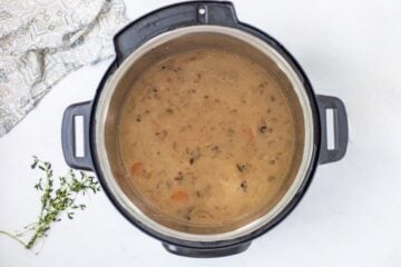 Wild rice soup inside Instant Pot after thickened with cream and cornstarch.