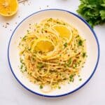 Spaghetti noodles tossed with garlic butter, olive oil, lemon, parsley, and fresh lemon.