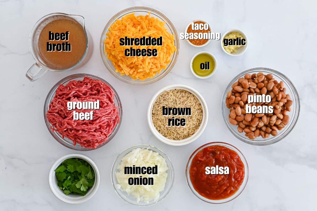 Taco Bake with Rice Ingredients for taco rice casserole labeled on counter.