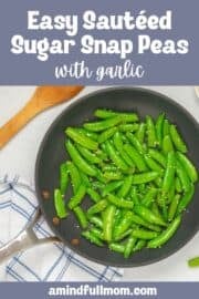 Bright green sugar snap peas in saute pan after being lightly steamed then sauteed with melted butter and minced garlic with text that reads Sauteed Sugar Snap Peas with garlic.
