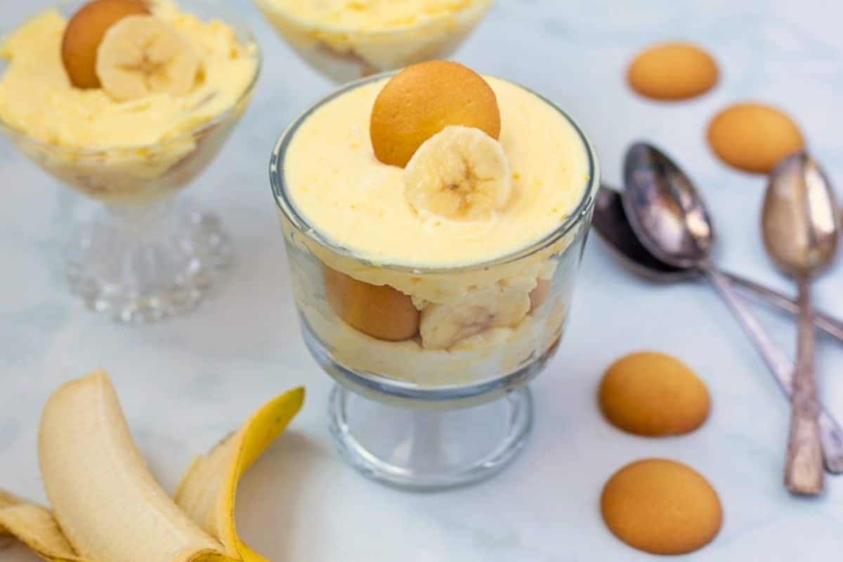 Easter Dessert Ideas Small trifle dishes filled with banana pudding layered homemade vanilla pudding, vanilla wafers, and bananas.