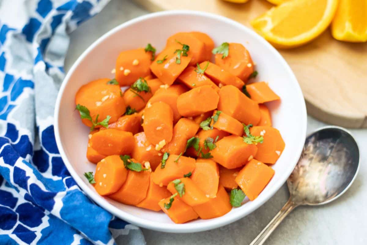 Easy Ideas for Easter Menu Bowl of carrots cut into chunks and glazed with maple syrup and orange juice.