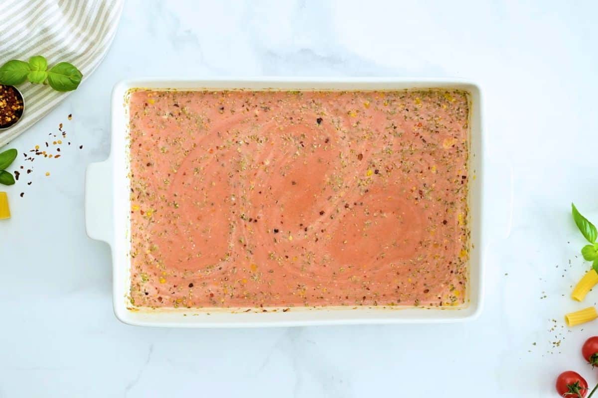 Pasta Bake No Boil Spaghetti sauce, heavy cream and seasonings whisked together in white casserole dish to create pasta bake sauce.