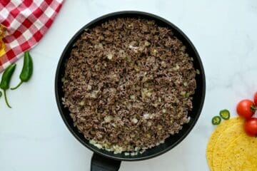 Lean ground beef browned with minced onion and minced garlic for base of beef enchilada filling.