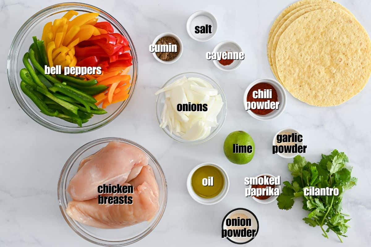 Sheet Pan Fajitas with Chicken Ingredients for easy chicken fajitas labeled on counter.