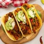 Roasted chicken, peppers and onions served in tortillas with sour cream and avocado and minced cilantro.