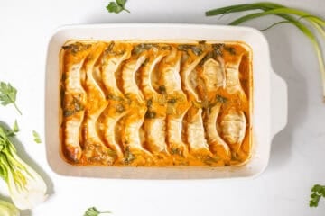 Baked dumplings in rich coconut broth with sliced baby bok choy.